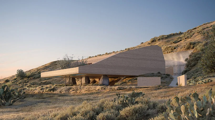 kapsimalis architects envisions two houses carved from rock in santorini