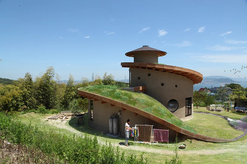 ryuichi ashizawa sets spiral family house with roof garden on awaji island in japan