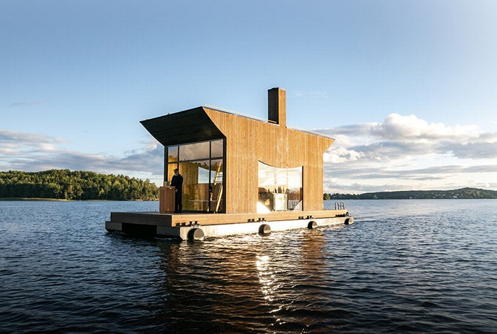 wooden boat sauna by sandellsandberg sails on stockholm archipelago