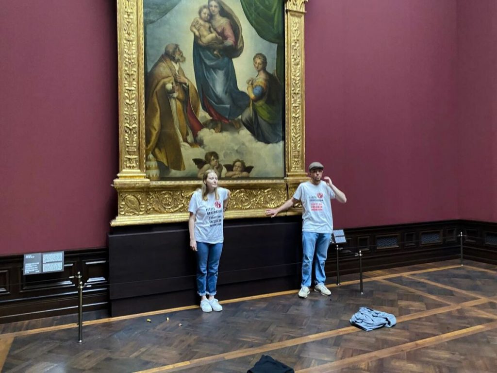 Two Climate Activists Who Glued Themselves to a Raphael Painting in Germany Have Been Hit With $1,600 Fines