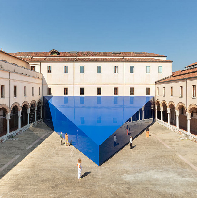 UNA/UNLESS` blue triangular pavilion lands in renaissance-era courtyard at venice biennale