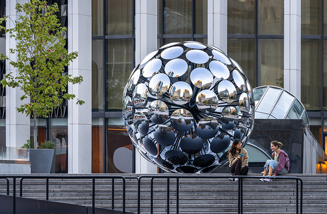 SpY`s steel and glass ORB installation reflects fragments of urban montreal