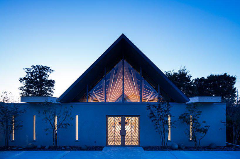 this buddhist temple in japan expresses a radiating timber roof structure